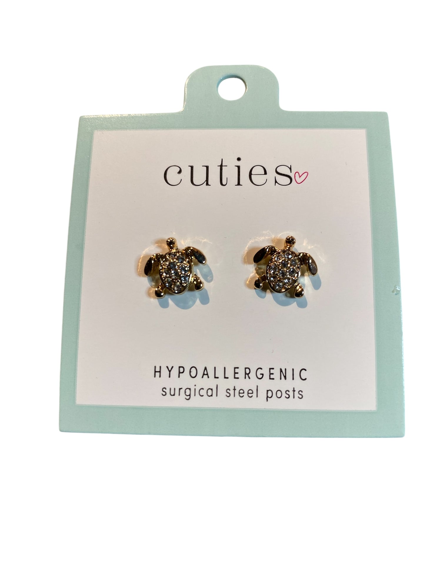 Tortoise-shaped earrings on a 'cuties' branded card with hypoallergenic information.