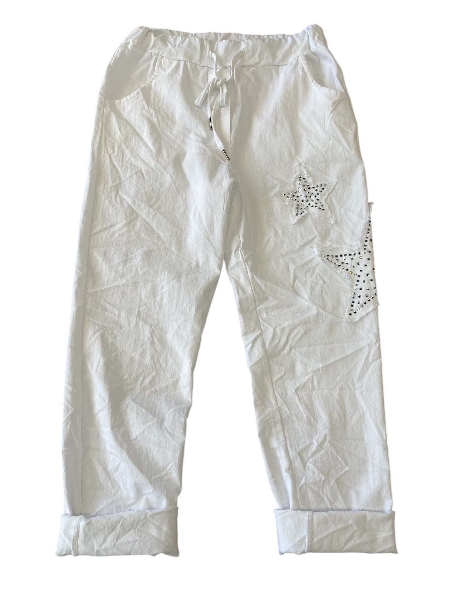 White pants with star-shaped embellishments on a white background