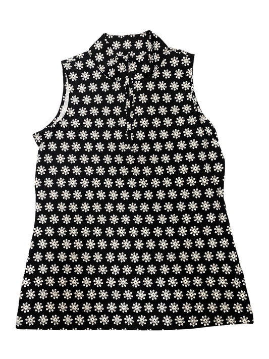 Black sleeveless dress with white floral pattern on a white background